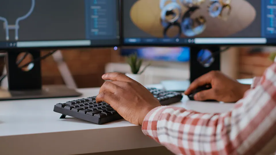 Male engineer designs 3d prototypes modern industrial interface